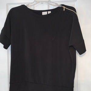 Black top with gold zipper accents on shoulders